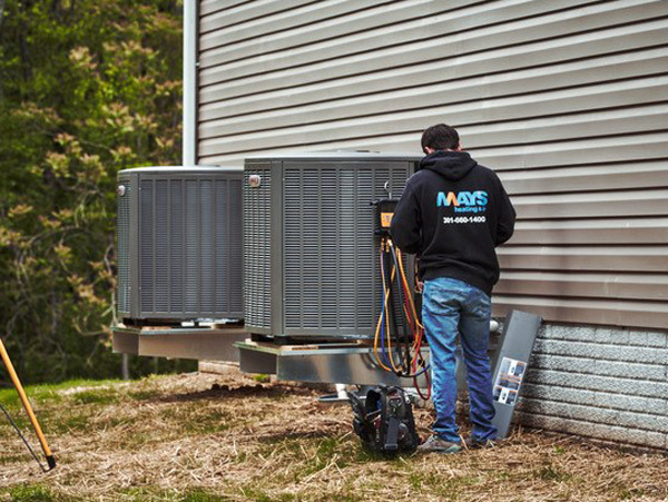 Mays tech repairing an AC unit